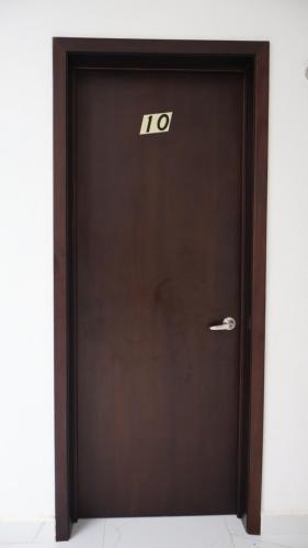 a brown door with the number on it at HOKAB in Cenote Azul