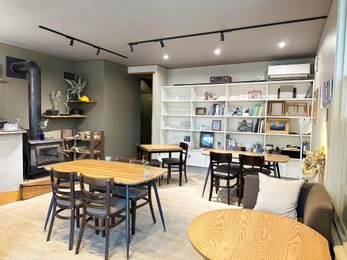 a restaurant with tables and chairs in a room at RONENAI BASE - Vacation STAY 87913v in Shibinai