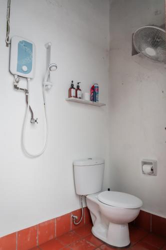 a bathroom with a toilet and a shower at Aayu Chowrasta - 3 mins walk to Penang Road Chendul in George Town
