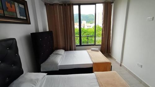 Ένα ή περισσότερα κρεβάτια σε δωμάτιο στο Apartamento Paraiso Family