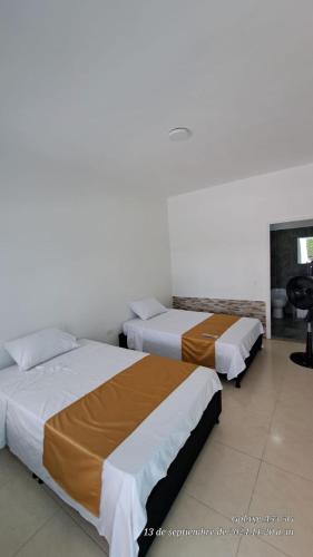 Ένα ή περισσότερα κρεβάτια σε δωμάτιο στο Casa Hotel Villa Sabrosura
