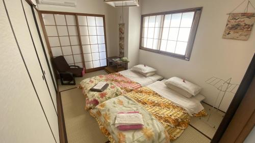 Postel nebo postele na pokoji v ubytování World Friendship Center Guesthouse