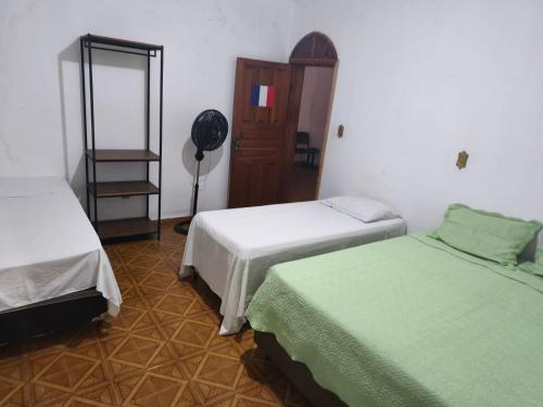 Ένα ή περισσότερα κρεβάτια σε δωμάτιο στο Hotel pousada Janaúba