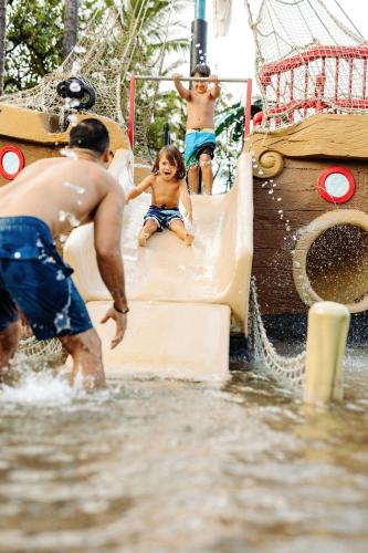 two children playing on a slide in the water at Marriott's Maui Ocean Club - Lahaina & Napili Towers in Lahaina