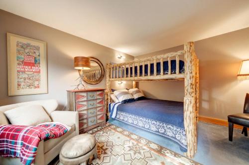 a bedroom with a bunk bed and a couch at 382 Sunburst in Big Sky