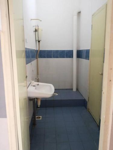 a bathroom with a sink and a toilet at Irah Homestay in Kuantan