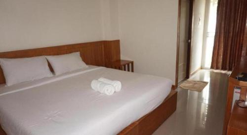 Ένα ή περισσότερα κρεβάτια σε δωμάτιο στο Loei Residence