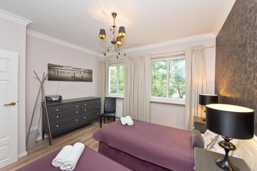 Cama o camas de una habitación en Dom & House - Old Town Swietego Ducha Economy
