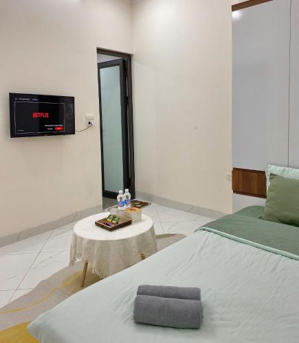 Ένα ή περισσότερα κρεβάτια σε δωμάτιο στο Hera West Lake Apartment