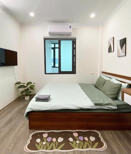 Ένα ή περισσότερα κρεβάτια σε δωμάτιο στο Hera West Lake Apartment
