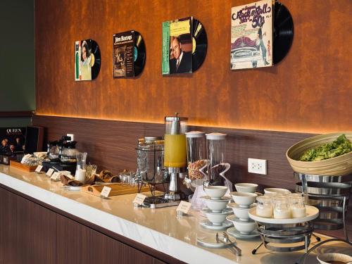 a counter in a restaurant with food on it at Record Hotel in Da Nang