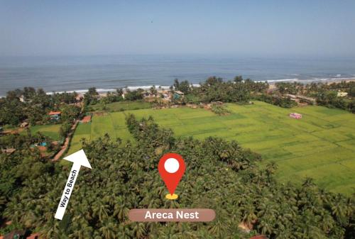 an aerial view of an area next to the ocean at Areca Nest in Gokarna