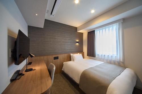 TV a/nebo společenská místnost v ubytování Hotel Eins Osaka Kadoma City Station
