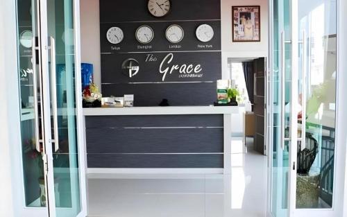 a store front with clocks on the wall at The Grace Residence in Surin