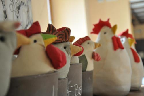 a group of toy chickens lined up in a row at Hotel Gasthof Vogelsang in Zellingen