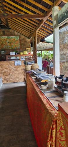 a kitchen with a counter with food on it at The Hidden Gem of Jembrana Bali in Mendaya