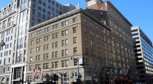 a large building with a clock tower on top of it at Hotel Harrington in Washington