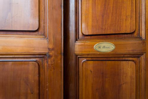 a wooden door with a sign on it at Residenza Marchesi Pontenani in Florence