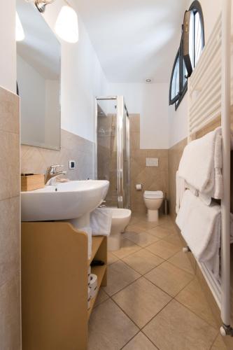a bathroom with a sink and a toilet at Residenza Marchesi Pontenani in Florence
