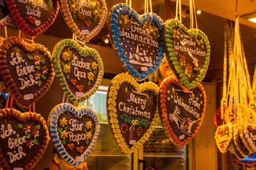 a bunch of heart cookies hanging in a store at Best Western Hotel zur Post in Bremen