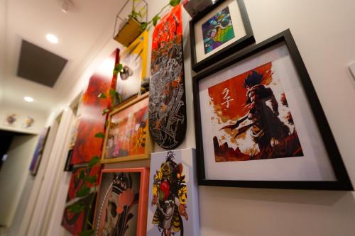 a bunch of pictures hanging on a wall at Luxe Cosy Room in Beechboro in Perth