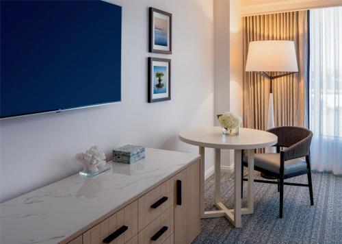 a hotel room with a table and a tv at Grand Hyatt Tampa Bay in Tampa