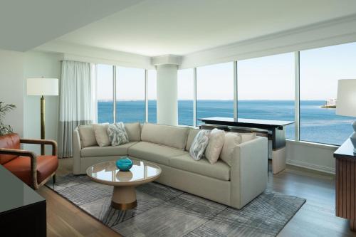 a living room with a couch and a piano at Grand Hyatt Tampa Bay in Tampa