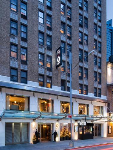 a large brick building with a sign on it at The Time New York, part of JdV by Hyatt in New York