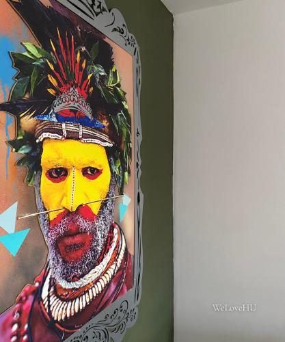 a painting of a man with a yellow face at Boutique 1 Bedroom Duplex Suite on Marina-304 in Hull