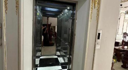 a mirror on a wall in a room at Phi Mai Hotel in Chau Doc