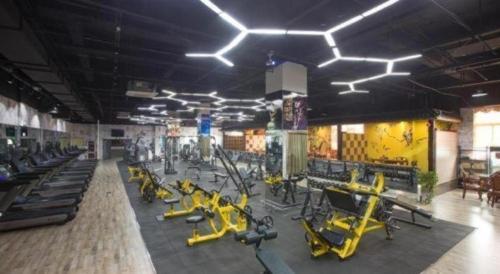 a gym with many rows of exercise bikes in it at GreenTree Inn Changzhou Wujin Bus Station in Changzhou