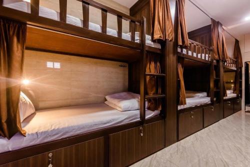 a couple of bunk beds in a room at Red House Hostels - POWAI HOSTELS GROUPS in Mumbai