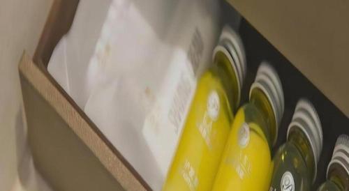 a group of green and yellow bottles in a drawer at Changshu Please Hotel in Changshu