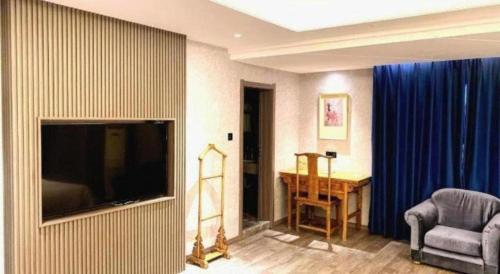 Télévision ou salle de divertissement dans l'établissement Xi'an Huiya Tianmu Hotel