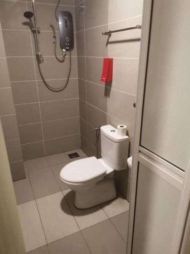 a bathroom with a shower and a toilet in it at SCC Velodrome KL in Kuala Lumpur