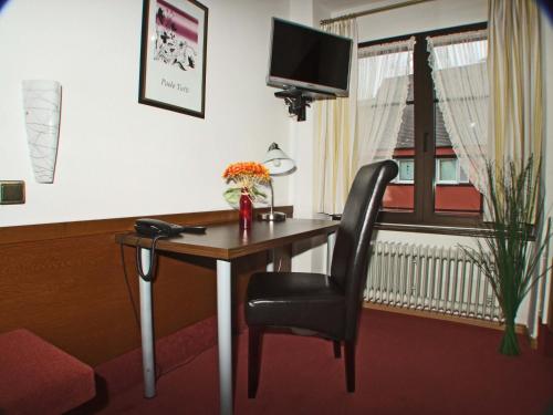 TV a/nebo společenská místnost v ubytování Hotel Beller