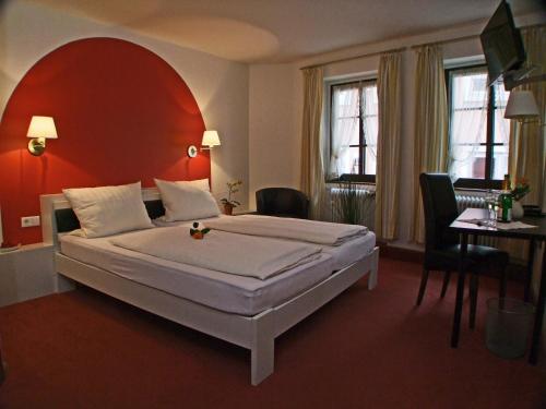 Postel nebo postele na pokoji v ubytování Hotel Beller