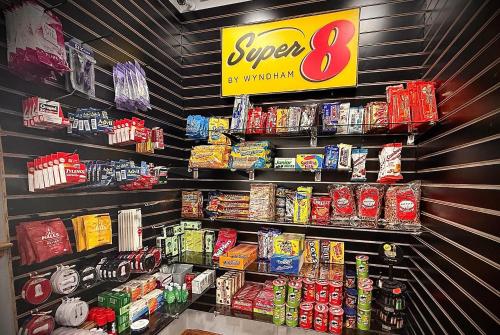a store with a shelf of food and drinks at Super 8 by Wyndham Uniontown PA in Uniontown