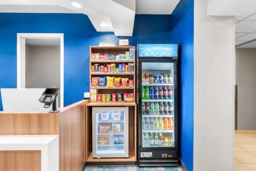 a refrigerator filled with lots of food and drinks at Microtel Inn & Suites By Wyndham Conway in Conway