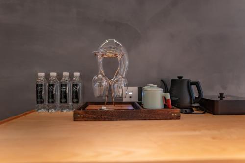 a glass clock sitting on top of a wooden table at 雾里观阵山 Foggy Valley in Zhangjiajie