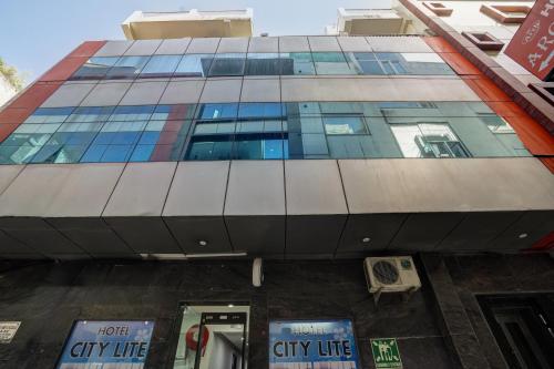 a tall building with a lot of windows at Hotel New City Lite Near Delhi in New Delhi