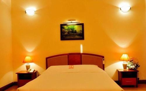 Кровать или кровати в номере CWD Hotel