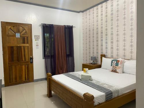 ELEN INN - Malapascua Island Air-conditioned Room2にあるベッド