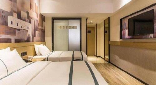 Cama o camas de una habitación en City Comfort Inn Nanning Railway Station Guangxi University