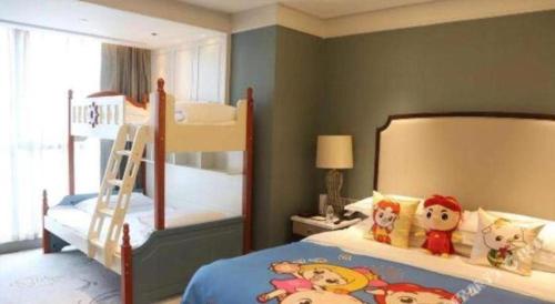 a bedroom with two bunk beds and a ladder at Xian Jue Vu Hotel in Xi'an