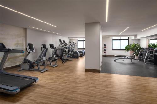 a gym with treadmills and elliptical machines at Embassy Suites by Hilton at Hot Springs Convention Center in Hot Springs