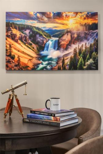 a pile of books on a table with a coffee cup at Starlite Yellowstone, Tapestry Collection by Hilton in West Yellowstone