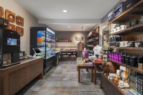 a grocery store with a person standing in the aisle at Starlite Yellowstone, Tapestry Collection by Hilton in West Yellowstone