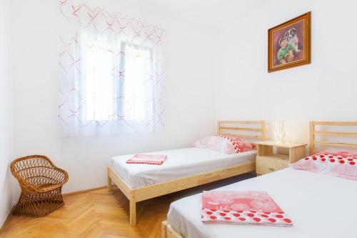 Postel nebo postele na pokoji v ubytování SAN Apartments