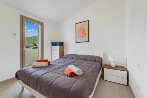 En eller flere senge i et værelse på Villa Bianca